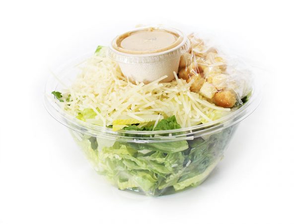 caesar salad with chicken in a white bowl